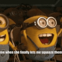 a group of minions are standing next to each other and laughing .