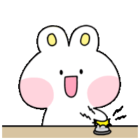 a cartoon rabbit is sitting at a table pressing a button