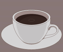 a cup of coffee sits on a saucer with a circle in the middle