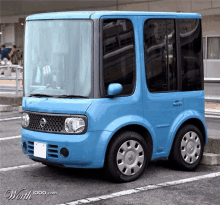 a small blue nissan car is parked in a parking spot