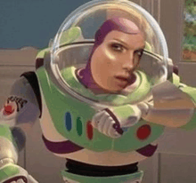 buzz lightyear from toy story is wearing a purple helmet and gloves .