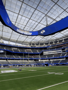 an empty football stadium with a sign that says championship on it