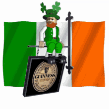 a leprechaun sitting on a guinness sign in front of an irish flag