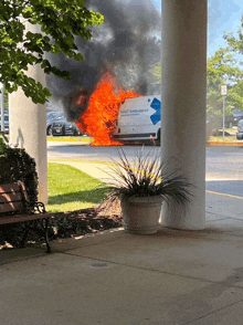 a smart ambulance is on fire in front of a building