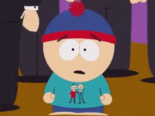 stan marsh from south park is wearing a blue shirt with two people on it