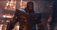 thanos is standing in front of a burning city