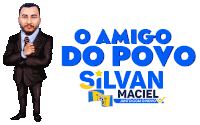 a man in a suit and tie is standing in front of a sign that says o amigo do povo