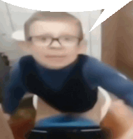 a blurry picture of a person with glasses and a speech bubble