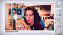 a man is holding a cat in front of a youtube screen that says you make me go through the worst