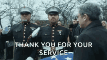 two men in military uniforms salute in front of a man with the words thank you for your service below them