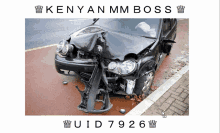 a picture of a wrecked car with kenyan mm boss written on the bottom