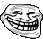 a black and white drawing of a troll face with a big smile on it .