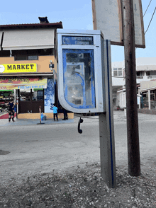 a phone booth with the word market on it