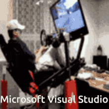 a blurred image of a person playing a video game with the words microsoft visual studio written below it