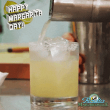 a margarita being poured into a glass with the words happy margarita day