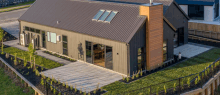 an aerial view of a house with a roof that has skylights on it