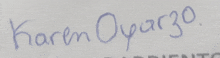 a close up of a person 's name written in blue