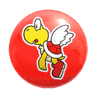 a red ball with a sticker of a cartoon character on it