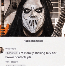 a man wearing a mask with a guitar in the background has 1881 comments