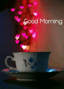 a cup of tea with hearts coming out of it and the words good morning