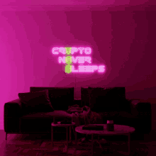 a living room with a couch and a neon sign that says crypto never sleeps