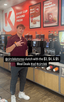 a man standing in front of a sign that says maple pumpkin meal deal