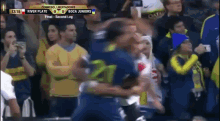 a soccer game is being played between river plate and boca juniors .