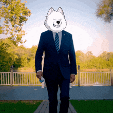 a man in a suit and tie has a dog head on his head