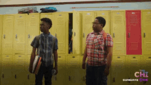 two boys standing in front of a row of yellow lockers with the words the chi sundays on the bottom right