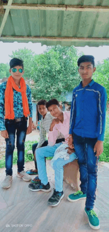 a group of young men posing for a picture with the words shot on oppo on the bottom left