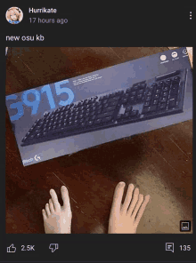 a person 's feet next to a logitech keyboard box