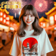 a woman wearing a t-shirt with totomacau on it