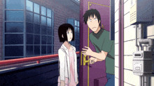 a man and woman are standing in front of a door