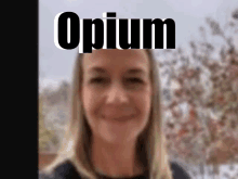 a blurry picture of a woman with the word opium on the top