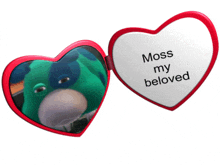 a heart shaped mirror with a picture of a green stuffed animal and the words moss my beloved