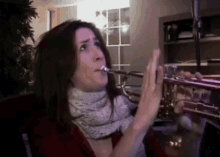 a woman is playing a trumpet with her mouth open