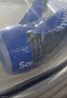 a blue airplane with the word sol on the side