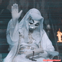 a man in a white robe with a mask on his face is holding a book