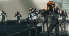 a group of clone troopers are standing in a line and one of them has a helmet that says rlx