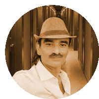 a man with a mustache wearing a hat and a white shirt