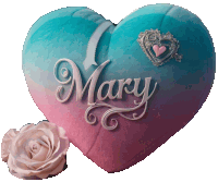 a blue and pink heart shaped pillow with the name mary on it