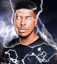 a man is standing in front of a lightning storm with lightning bolts coming out of his eyes .