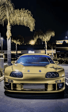 a yellow sports car is parked in front of a store called pepsi