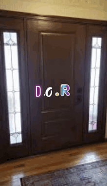 a door with stained glass windows and the words d.o.r. on it