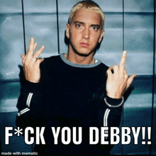 a picture of eminem giving the middle finger with the caption " f * ck you debby !! "