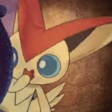 a close up of a cartoon pokemon with a red hat on .