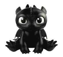 toothless from how to train your dragon is sitting on a white surface