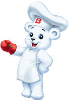 a teddy bear wearing a chef 's hat and apron with the letter b on it