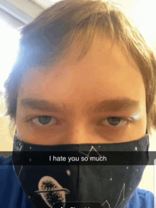 a man wearing a face mask with a caption that says i hate you so much