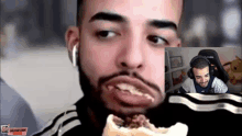 a man with a beard is eating a sandwich with his mouth open